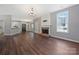 Spacious living room with a cozy fireplace and hardwood floors at 8430 Forest Shadow Cir, Cornelius, NC 28031