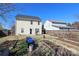 Backyard features raised garden beds and lush greenery, creating a tranquil outdoor space at 920 Lakehill Rd, Charlotte, NC 28214