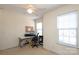Well-lit bedroom featuring a ceiling fan, natural light, and a view of the outdoors at 920 Lakehill Rd, Charlotte, NC 28214