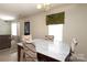 Cozy dining room with modern chairs, dining table, and natural light at 920 Lakehill Rd, Charlotte, NC 28214