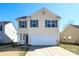 Charming two-story home with blue shutters and a two car garage at 920 Lakehill Rd, Charlotte, NC 28214