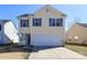 Charming two-story home with blue shutters and a spacious two-car garage at 920 Lakehill Rd, Charlotte, NC 28214