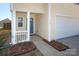 Inviting front porch with white columns and blue front door at 920 Lakehill Rd, Charlotte, NC 28214