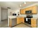 Well-lit kitchen with stainless steel appliances and breakfast bar at 920 Lakehill Rd, Charlotte, NC 28214