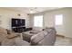 Comfortable living area with large window and neutral tones at 920 Lakehill Rd, Charlotte, NC 28214