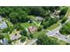 Aerial view showcases a house with big yard, with lush greenery with other residences nearby at 9808 Washam Potts Rd, Cornelius, NC 28031