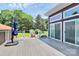 Spacious back deck area with outdoor seating and lovely backyard views at 9808 Washam Potts Rd, Cornelius, NC 28031