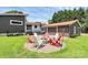 Cozy backyard fire pit area with seating, perfect for outdoor entertaining at 9808 Washam Potts Rd, Cornelius, NC 28031