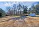 Large backyard featuring a detached garage or workshop and ample space for outdoor activities at 9808 Washam Potts Rd, Cornelius, NC 28031