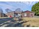 Spacious backyard with a hammock, patio, and sheds, offering a private outdoor retreat at 9808 Washam Potts Rd, Cornelius, NC 28031