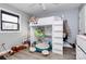Bedroom featuring a loft bed with a playful arrangement of stuffed animals and a window at 9808 Washam Potts Rd, Cornelius, NC 28031