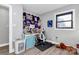 Bright bedroom features stylish décor, desk, and a light-filled window for a creative workspace at 9808 Washam Potts Rd, Cornelius, NC 28031