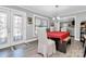 Bright dining room features a stylish light fixture, a table with chairs, and a glass front door at 9808 Washam Potts Rd, Cornelius, NC 28031