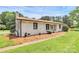 Lovely brick home with a manicured lawn and a side driveway at 9808 Washam Potts Rd, Cornelius, NC 28031