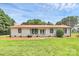 Beautiful home with manicured lawn, trimmed shrubs, and a clean, classic aesthetic at 9808 Washam Potts Rd, Cornelius, NC 28031