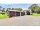 Large two-car garage with an extended driveway, providing ample parking and storage at 9808 Washam Potts Rd, Cornelius, NC 28031