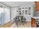 Bright eat-in kitchen featuring an eating nook, tiled floor, and plenty of storage space at 9808 Washam Potts Rd, Cornelius, NC 28031