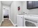 Well-equipped laundry room with modern washer and dryer units, maximizing efficiency and convenience at 9808 Washam Potts Rd, Cornelius, NC 28031