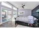 Spacious bedroom featuring large windows and access to the deck at 9808 Washam Potts Rd, Cornelius, NC 28031