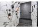 Luxurious shower showcasing dual shower heads, sleek bench, and elegant tile design at 9808 Washam Potts Rd, Cornelius, NC 28031