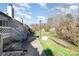 Backyard view showcasing a well-maintained walkway, grassy area, and charming outdoor space on a sunny day at 100 Willow Run Dr # 7, Gastonia, NC 28056