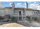 Backyard with a small deck and stairs leading to a patio area, highlighting outdoor living at 100 Willow Run Dr # 7, Gastonia, NC 28056