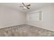 Bedroom features neutral carpet, ceiling fan and large window at 100 Willow Run Dr # 7, Gastonia, NC 28056