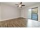 Bedroom with fan, door to balcony and wood floors at 100 Willow Run Dr # 7, Gastonia, NC 28056