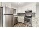 Kitchen featuring stainless appliances, white cabinets, and modern countertops at 100 Willow Run Dr # 7, Gastonia, NC 28056