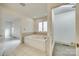 Bathroom featuring tile floors, a jacuzzi tub, and a linen closet at 10033 Bora Bora Dv, Tega Cay, SC 29708