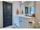 Bathroom featuring a white vanity with a dark faucet and a large mirror at 1013 Oakmont Dr, Rock Hill, SC 29732