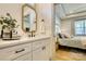 Bathroom vanity featuring a black faucet, mirror, and marble countertops at 1013 Oakmont Dr, Rock Hill, SC 29732