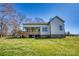 Back exterior with a covered porch and backyard at 1013 Oakmont Dr, Rock Hill, SC 29732