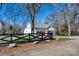 Exterior view of a charming home with a black wood fence, well-manicured lawn and attractive landscaping at 1013 Oakmont Dr, Rock Hill, SC 29732