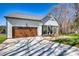 Lovely home featuring a gray roof, a spacious driveway, and a welcoming front porch, all surrounded by a verdant yard at 1013 Oakmont Dr, Rock Hill, SC 29732