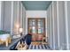 A charming porch with double doors, stylish decor, and a black and white checkered rug at 1013 Oakmont Dr, Rock Hill, SC 29732