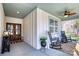 A charming front porch with rocking chairs, neutral walls, a ceiling fan, and stylish decor at 1013 Oakmont Dr, Rock Hill, SC 29732