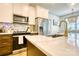 Kitchen island featuring a marble countertop, stainless steel appliances, and white cabinets at 1013 Oakmont Dr, Rock Hill, SC 29732