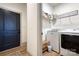 Functional laundry room with a washing machine, dryer, and shelving for organized storage at 1013 Oakmont Dr, Rock Hill, SC 29732