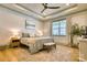 Bright main bedroom featuring a ceiling fan, bench, stylish decor, and natural light at 1013 Oakmont Dr, Rock Hill, SC 29732
