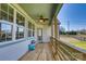 This is a porch with a ceiling fan and a small table at 1013 Oakmont Dr, Rock Hill, SC 29732