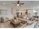 Bright, open-concept living room flows into modern kitchen featuring stainless appliances and a large central island at 1049 Kinship Dr # 77, Lancaster, SC 29720