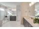 Bright bathroom features a glass shower, dual sinks, and white tile at 1049 Kinship Dr # 77, Lancaster, SC 29720