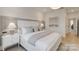 Serene main bedroom featuring a white bed frame, neutral decor, and hardwood floors at 1049 Kinship Dr # 77, Lancaster, SC 29720