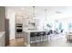 Bright, open kitchen features an island with bar seating, pendant lighting, stainless steel appliances and dining area at 1055 Kinship Dr # 78, Lancaster, SC 29720