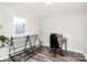 Bedroom with light gray walls, and desk with modern chair at 1061 Gaither Nw Pl, Concord, NC 28027
