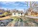 An inviting bungalow with a covered front porch and a walkway leads up to the front of the home at 1061 Gaither Nw Pl, Concord, NC 28027