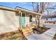 Inviting front porch with seating area and freshly planted flowerbeds at 1061 Gaither Nw Pl, Concord, NC 28027
