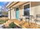Welcoming front porch with outdoor seating and manicured landscaping details at 1061 Gaither Nw Pl, Concord, NC 28027