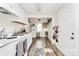 Inviting kitchen with white cabinets and a vintage refrigerator, offering a cozy cooking environment at 1061 Gaither Nw Pl, Concord, NC 28027